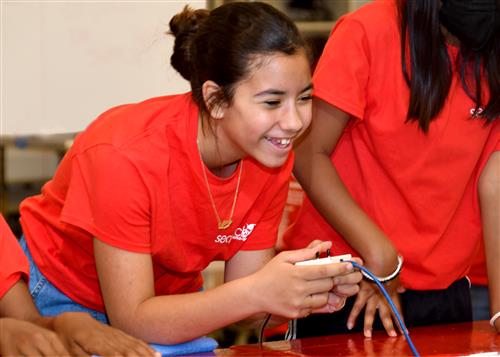 Students drives her underwater ROV at hydro-lab at United States Naval Academy.